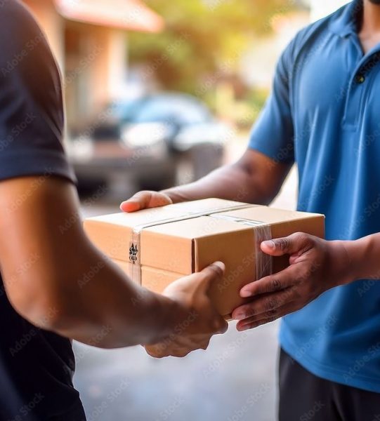 close up courier service concept,Young man receiving package from a delivery